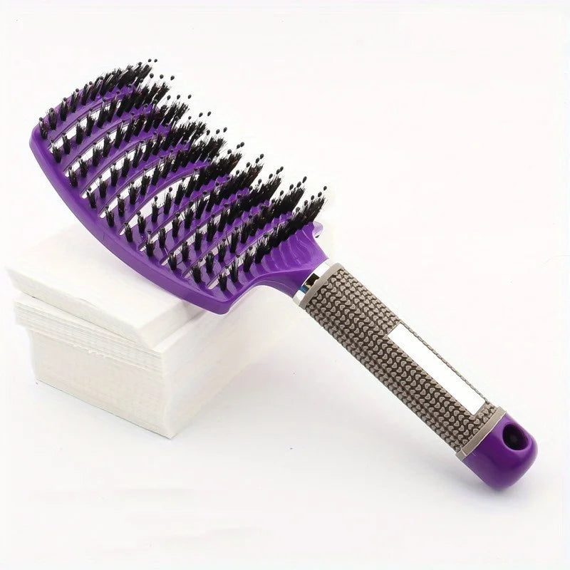 Purple and black hairbrush on a white background