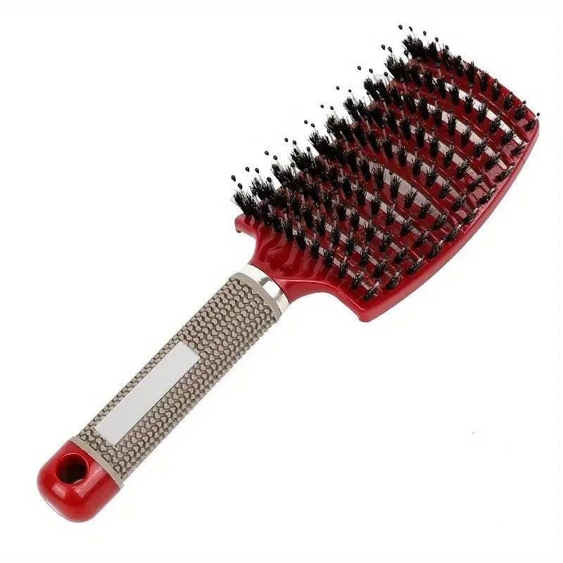 Red hairbrush with black bristles on a white background